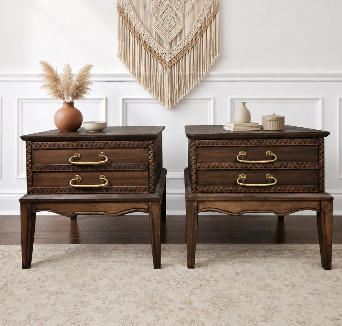 Carved walnut nightstand pair with chevron border relief and brass bail pulls